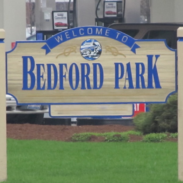 Tan and Blue Welcome Sign for "Bedford Park"