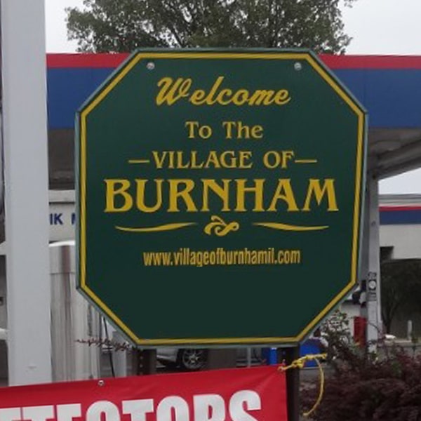 Green and Yellow Welcome Sign for "The Village of Burnham"