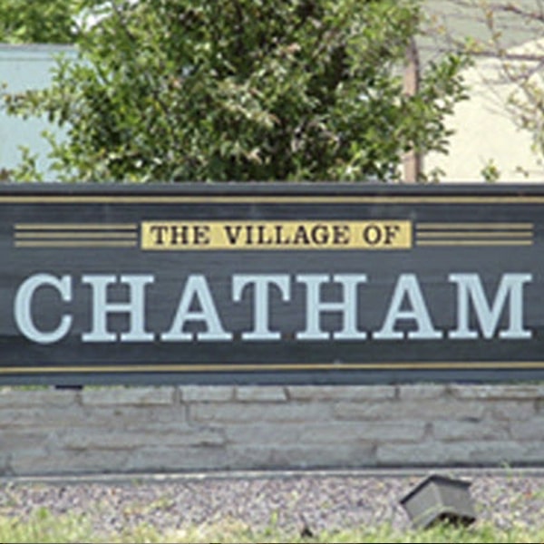 Grey and Yellow Welcome Sign for "The Village of Chatham"
