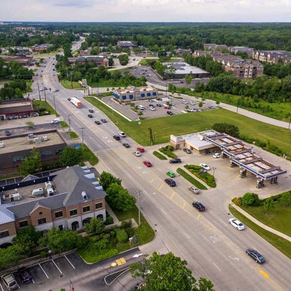 Cars Driving through Town