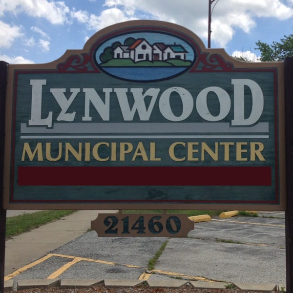 Wood Blue, Red, and Yellow Welcome Sign for "Lynwood Municipal Center"